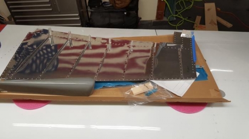 Ribs partially riveted to skins