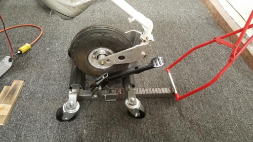 The sheel mover modified to fit the smaller airplane wheel and with a towbar attachment.