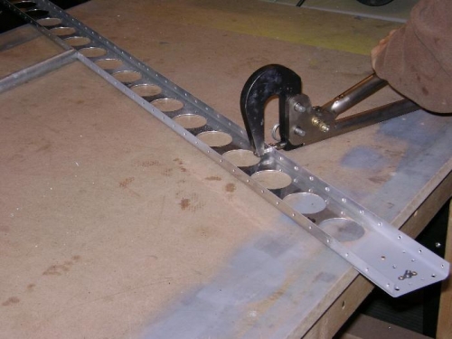 Dimpling the right aileron spar with the hand squeezer