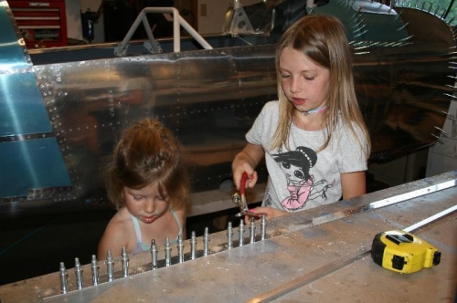 Mary (left) and Sydney helping me drill the center canopy rail assembly.