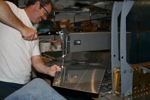 Dimpling the bottom skin for flush rivets.