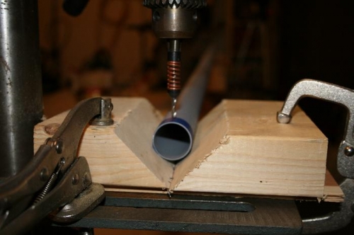 A drill press makes this much easier. The 'v blocks' also made it alittle easier.