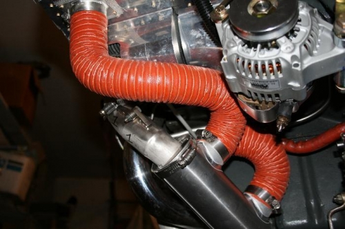 Scat hose running into and out of the exhaust muff