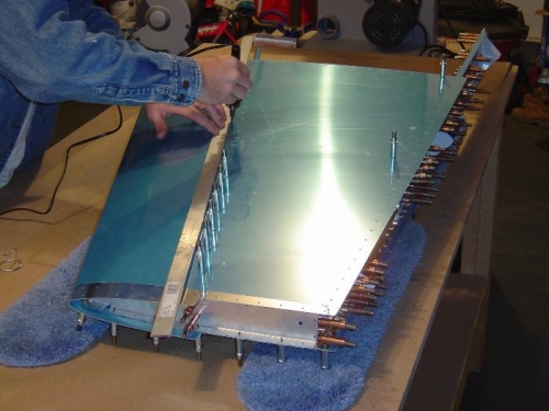 Trimming the protective plastic for riveting