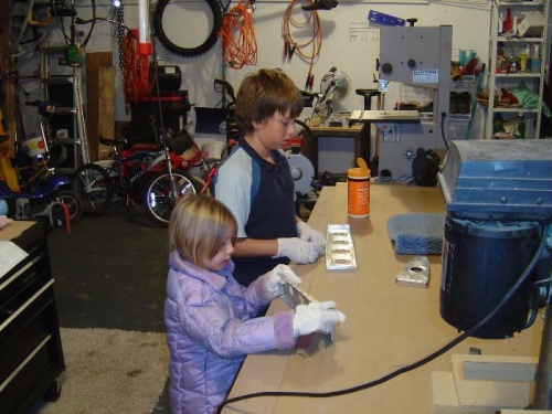Sydney and Mitchel with the scotchbrite working on scuffing the VS ribs