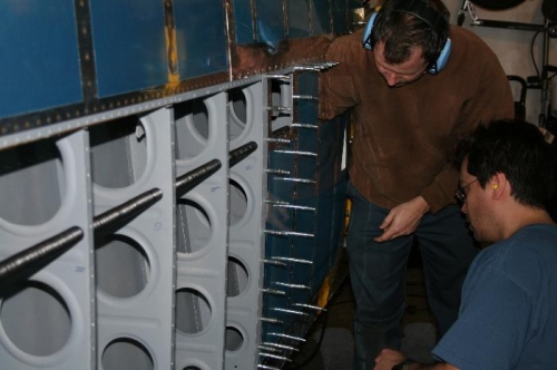 Here's me (standing) and Mike riveting the right wing inboard panel.