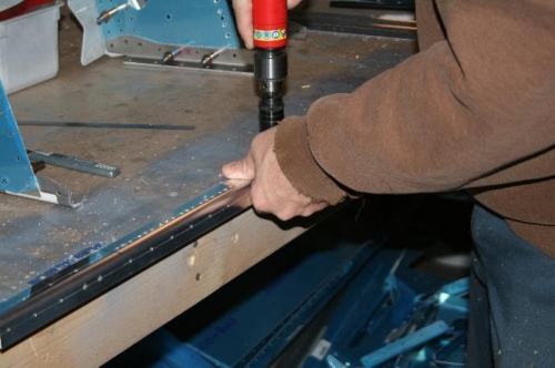 Countersinking the mating surface to accept the nutplate rivets and screws.