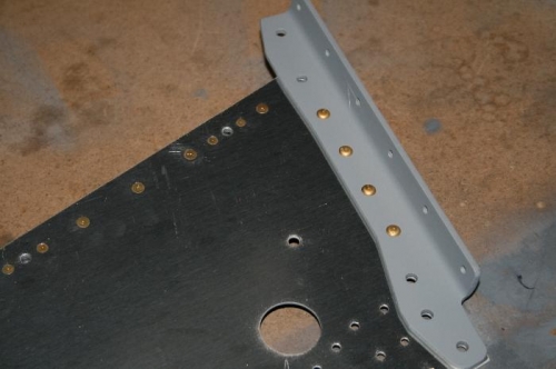 The corner angle riveted on - the other holes are for 3/16