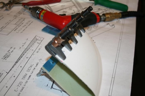 Right side HS Tip getting drilled for nutplates. Note the backing stip visible (blue).