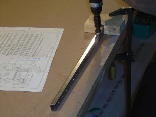 Maching counter-sinking the false spar top rivet holes per the plans.