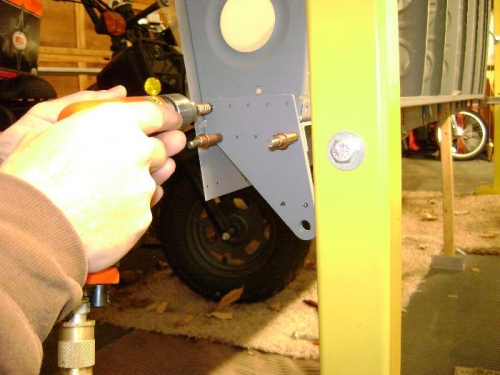 Match drilling the right wing outboard aileron bracket to the rib.