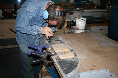 Trimming the aft baggage bulkhead with the dremmel bit.