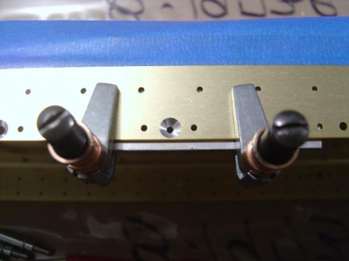 Close up of the #6 screw hole counter-sunk with a #40 counter-sink cutter with jig in place.