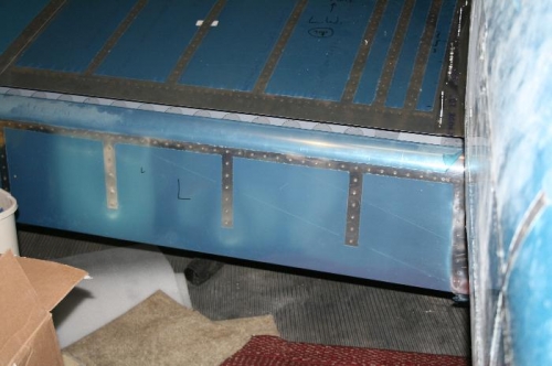 Left flap rod being installed.