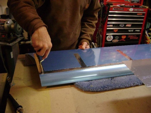 Hole deburring. (Top left flap skin)