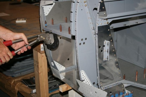 Dimpling the stiffler in the fwd side skin that ties to the front baggage shelf.