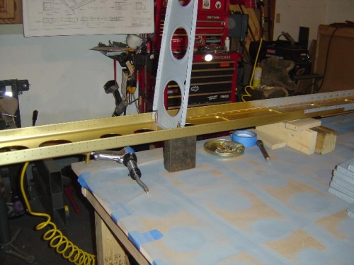 Spar blocked up (note big steel block) and the rib cleco'd into place for riveting.