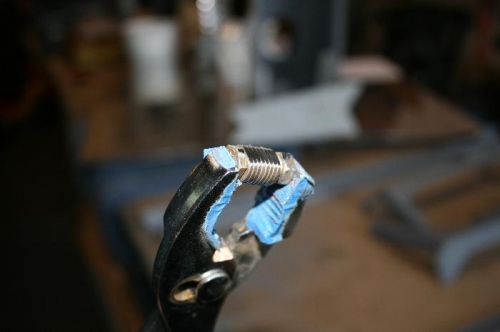 Radiused washers on the bench grinder.