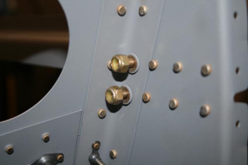 Upper bracket locknuts and rivets (from the inside).