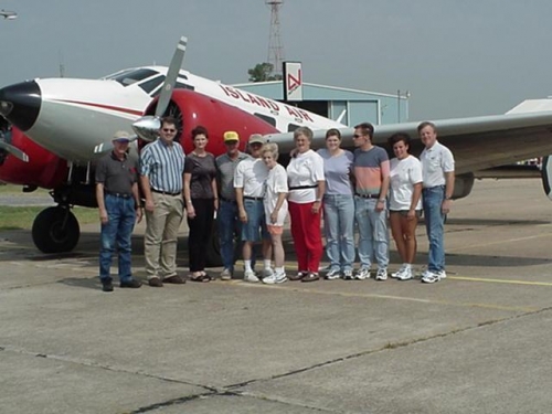 Jim Brewer and his gang at KDUC getting set for OSH. Tallest guy in the photo is Jim (his airplane)