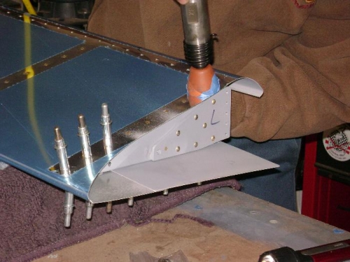 Shooting the rivets that tie the inboard rib to the top skin.