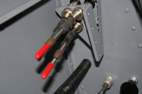 Cables routing into the cockpit and loosely in place on the support bracket