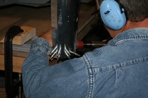 Note here I have the F812 bulkhead clamped to the bench - that worked great for shooting the rivets.