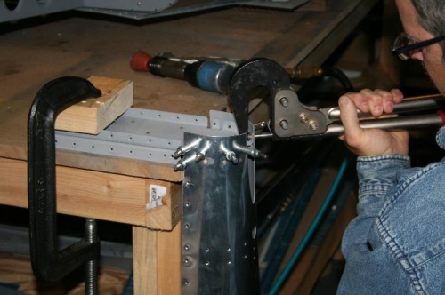 Here it is flipped over and I'm squeezing the aft row of rivets with good access.