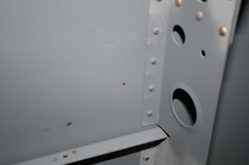 The tiny red dot near the vertical line of rivets is where the hole will go on the right side.