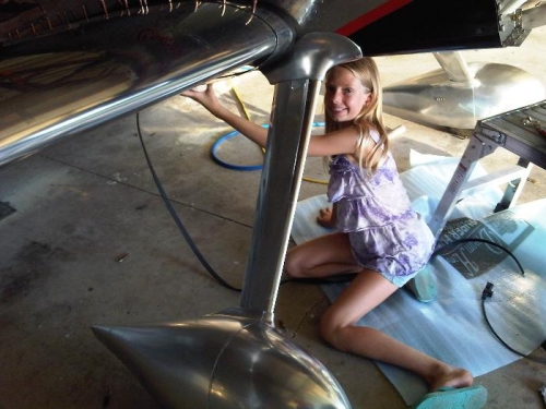 Sydney helping keep the fairing in place while I get the gasket on