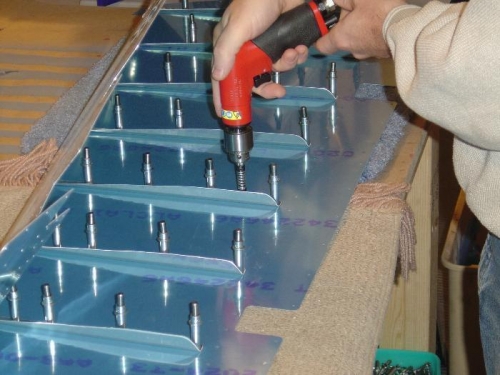 Drilling elevator stiffners to the skins