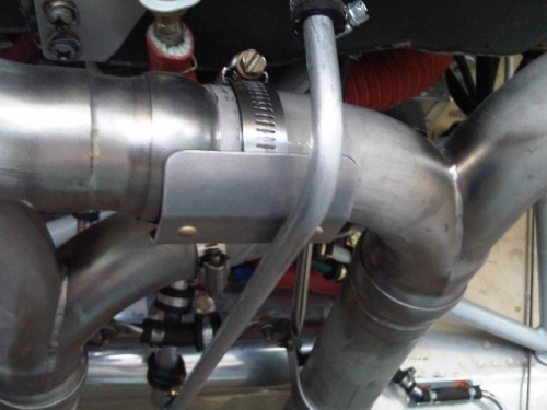 Heat shield for sniffle valve drain line