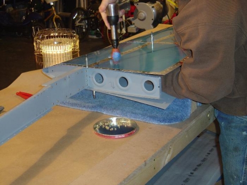 continuing to rivet top side of Left hand HS