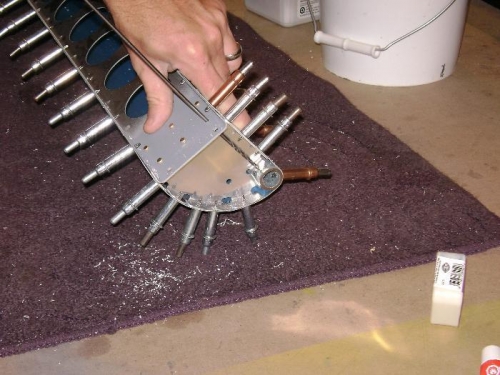 Drilling the counterweight to nose rib hole with a long 1/8 bit.