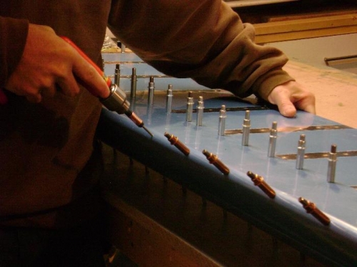 Match-drilling the nose skin to the counterbalance weight (pipe) to #30.