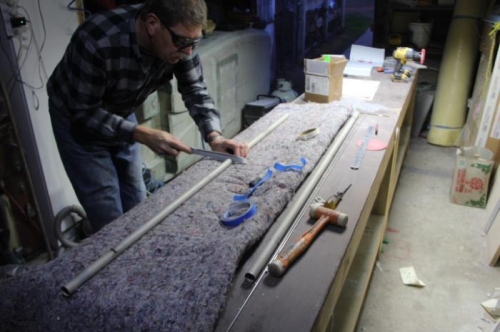 Filing slots in the torque tubes for the hinges