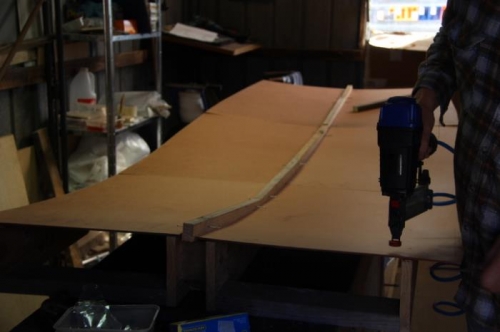 Tacking on the foam. Flat head nails would have been better