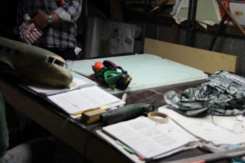 Visitor shows a fibreglassed model DC2 fuselage while I'm trimming the seatback...