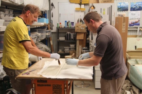 Wetting out the front seat thigh supports