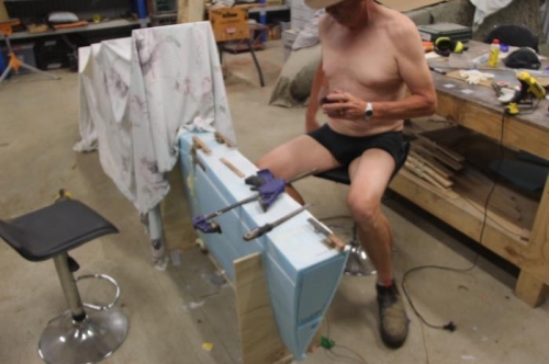 Captain underpaints inspecting installation over a lovely shiraz