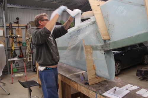 Boof the layup into the cove and dig out the peel ply, re-used for the Aileron layup