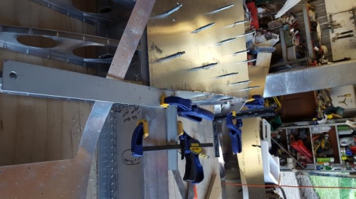 There never seems to be enough clamps, this triple checking for square before drilling the top skin.