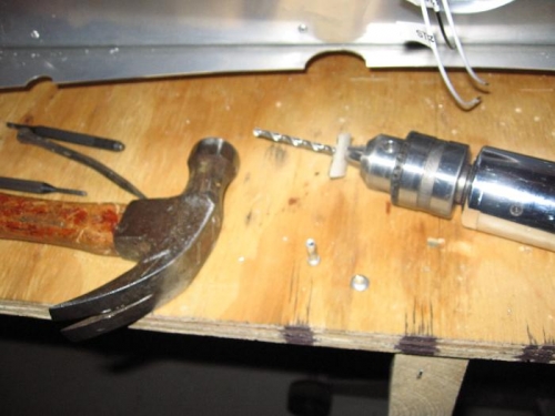 Drilled out/punched out solid rivet