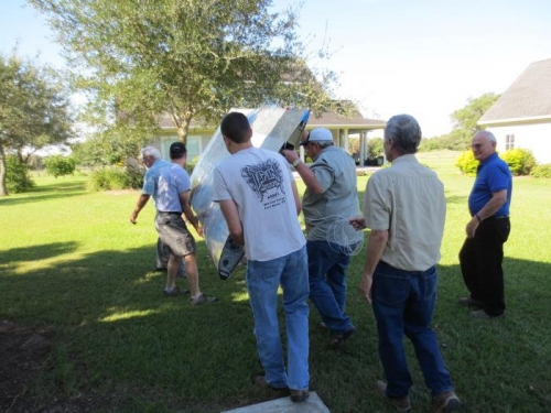 Carrying right wing to back side of shop