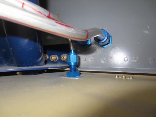 Brake fitting through bottom of fuselage