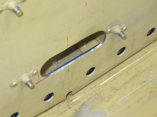 Slotted trim cable hole in F-604A