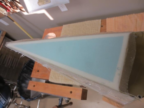 Laid up fiberglass on edge of flap