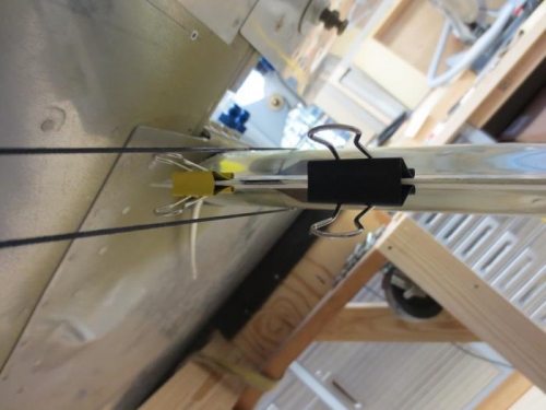 Trailing edge between the strings