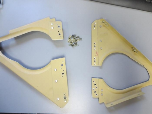 Putting nutplates on seat rib