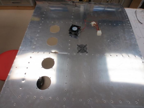 Holes cut for defrost fans